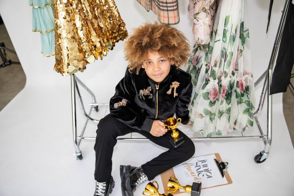 Boy holding award